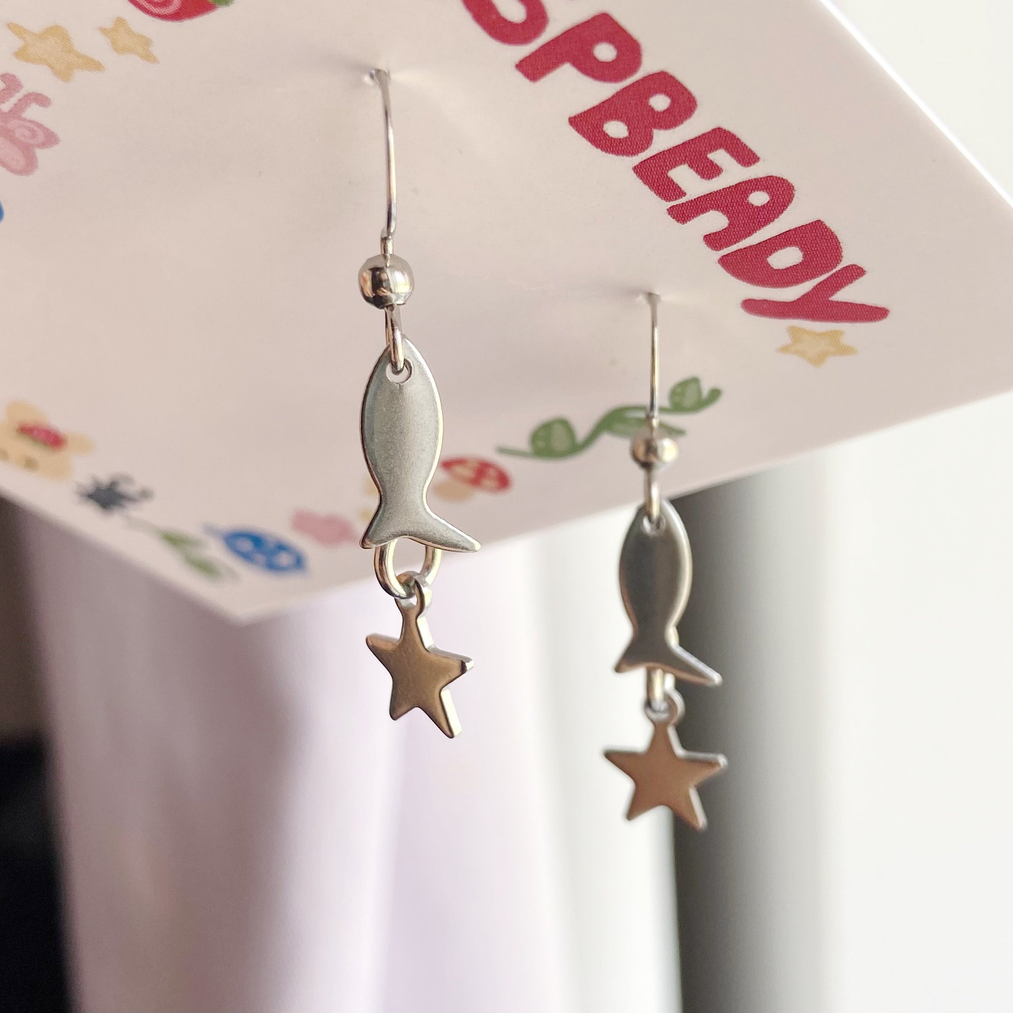 Fish charm earrings